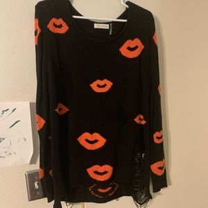 Distressed kiss sweater worn twice